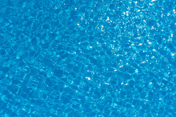 Blue and bright water surface in swimming pool