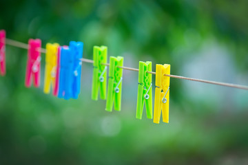  colored clothespins on rope