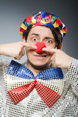 Funny clown against dark background