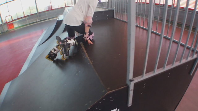 child roller skating up and down trampolines