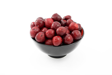 red cherry in black bowl