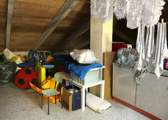 Attic with many things and clothes hung out to dry - obrazy, fototapety, plakaty