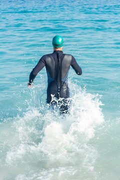 Swimmer Running In The Ocean