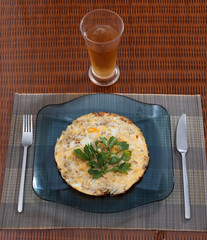 Omelette with fried eggs, sprouts, onions and parsley