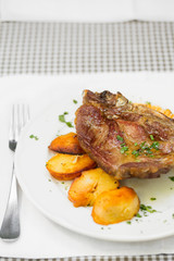 Lunch/Tasty grilled pork steak with roasted potato
