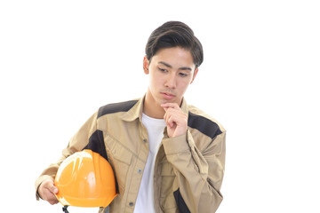 苦悩する作業員