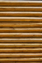fence of stacked round trunks wood pattern