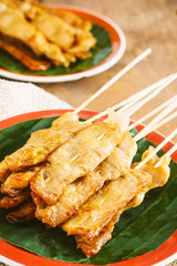 Pork Satay with delicious peanut sauce, one of famous local dishes.