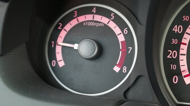 Car tachometer and moving pointer on it.