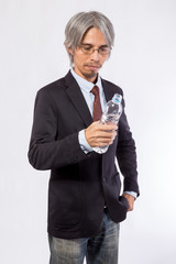 business man drinking water on white background