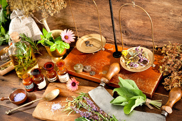 Ancient natural medicine, herbal, vials and scale on wooden background