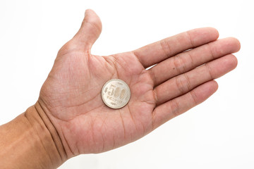 Fototapeta na wymiar Japanese coin in hand (Yen)
