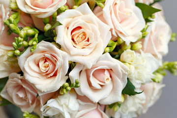 beautiful bridal bouquet of roses at a wedding party