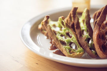 Green tea flavour  waffle on white plate closeup