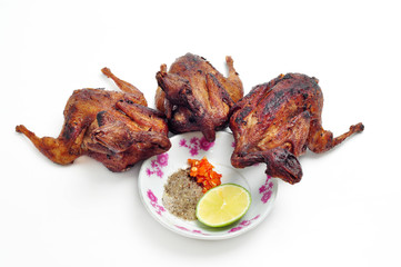 Vietnamese grilled quail on a white background