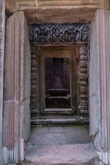 lintel and columns with bas-reliefs inside the prasat of the temple of chau say tevoda in siam reap, cambodia