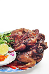 Vietnamese grilled quail on a white background