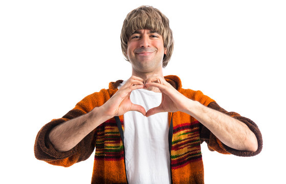 Blonde man making a heart with his hands