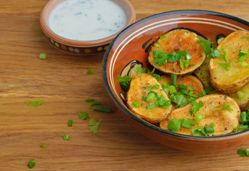 Oven-baked potatoes with herbs.