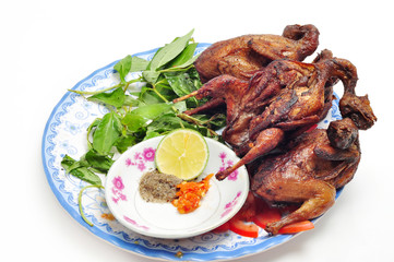 Vietnamese grilled quail on a white background