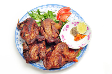 Vietnamese grilled quail on a white background