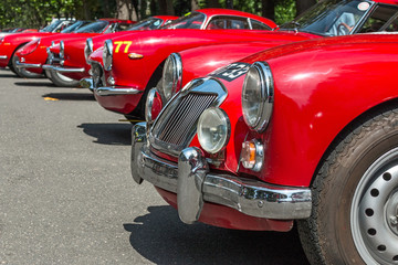 Fototapeta premium exposition of old red car in line 