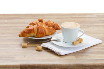 cup of coffee with croissant