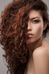 Naklejka premium woman with healthy brown curly hair