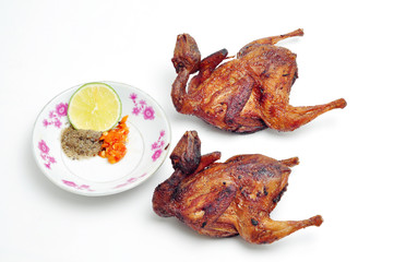 Vietnamese grilled quail on a white background