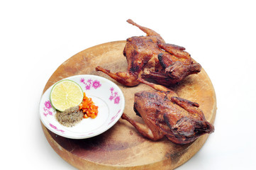 Vietnamese grilled quail on a white background