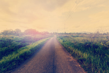 Vintage photo of field and road with sunlight