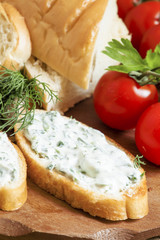 Bruschetta with white sauce and herbs, selective focus