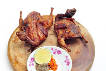 Vietnamese grilled quail on a white background