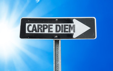 Carpe Diem direction sign with a beautiful day