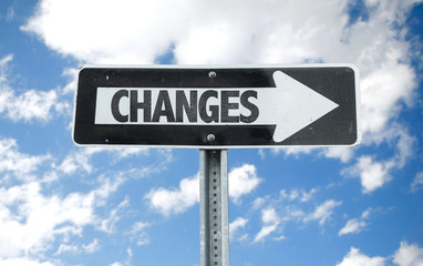 Changes direction sign with sky background