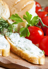 Bruschetta with white sauce and herbs, selective focus