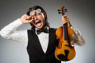 Man playing violin in musical concept