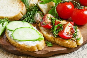 Two types of sandwiches: tomato and cucumber, selective focus
