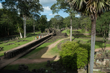 sight of the roadway and the ponds of the mountain pyramid of the baphuon in the archaeological angkor thom place in siam reap, cambodia