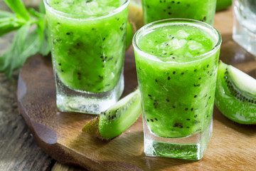 Fresh green smoothie with kiwi, cucumber, selective focus