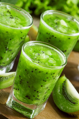 Fresh green smoothie with kiwi, cucumber, selective focus
