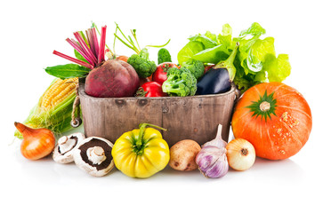Fresh vegetables in wooden bucket with leaf lettuce. Isolated © Yasonya