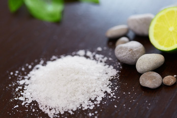 Spa Background. Sea Salt with Lime Stones and Candle . Body scru