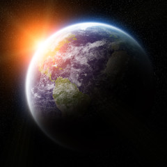 Sunrise over planet Earth in space