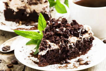 Chocolate and coffee cake with butter cream, selective focus