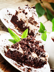 Chocolate and coffee cake with butter cream, selective focus