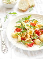 orecchiette pasta with cherry tomatoes, arugula and Parmesan