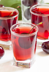 Fresh cherry juice with berries, selective focus