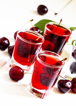 Fresh cherry juice with berries, selective focus