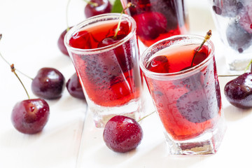 Fresh cherry juice with berries, selective focus